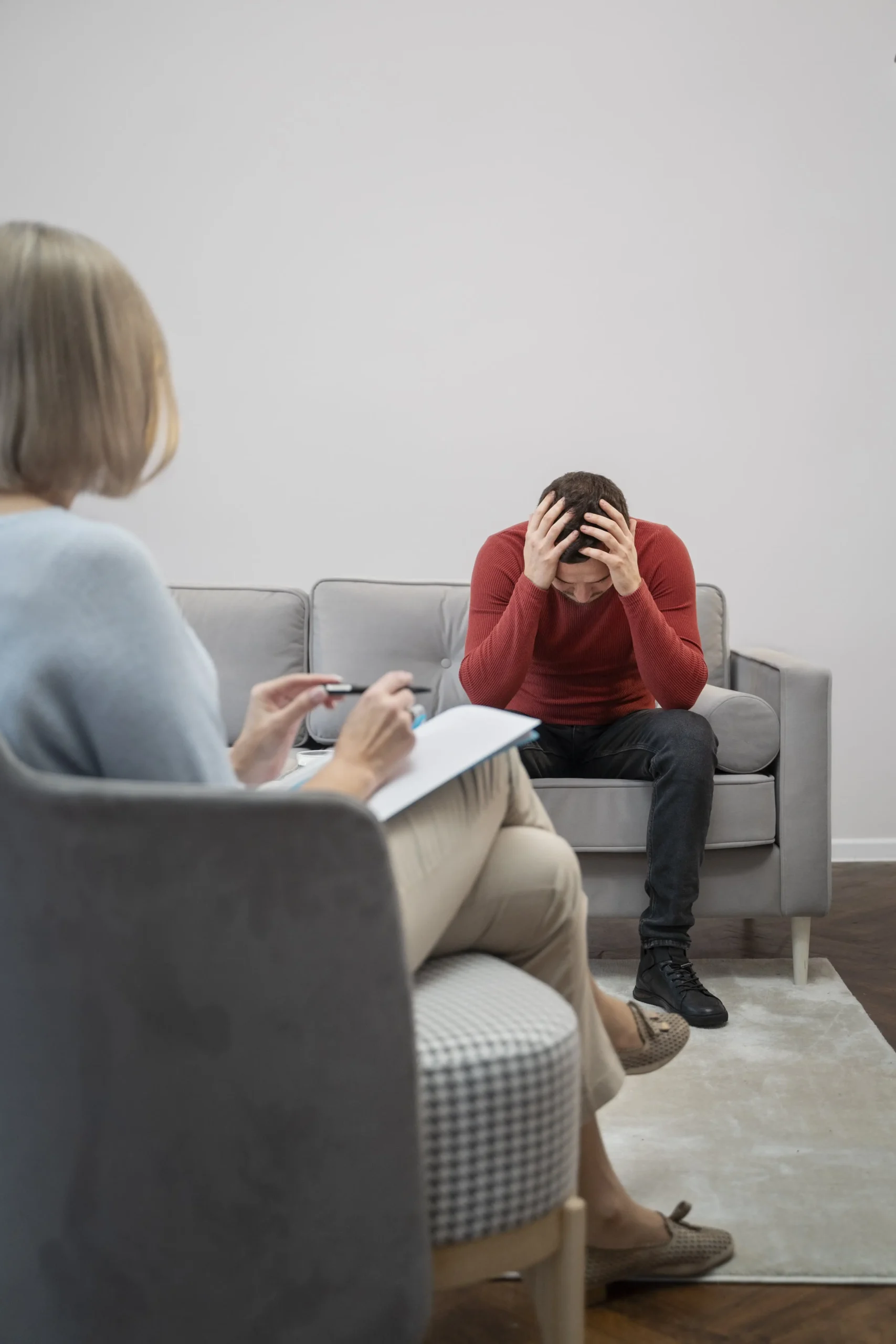 person suffering from ptsd psychologist min 1 scaled 2